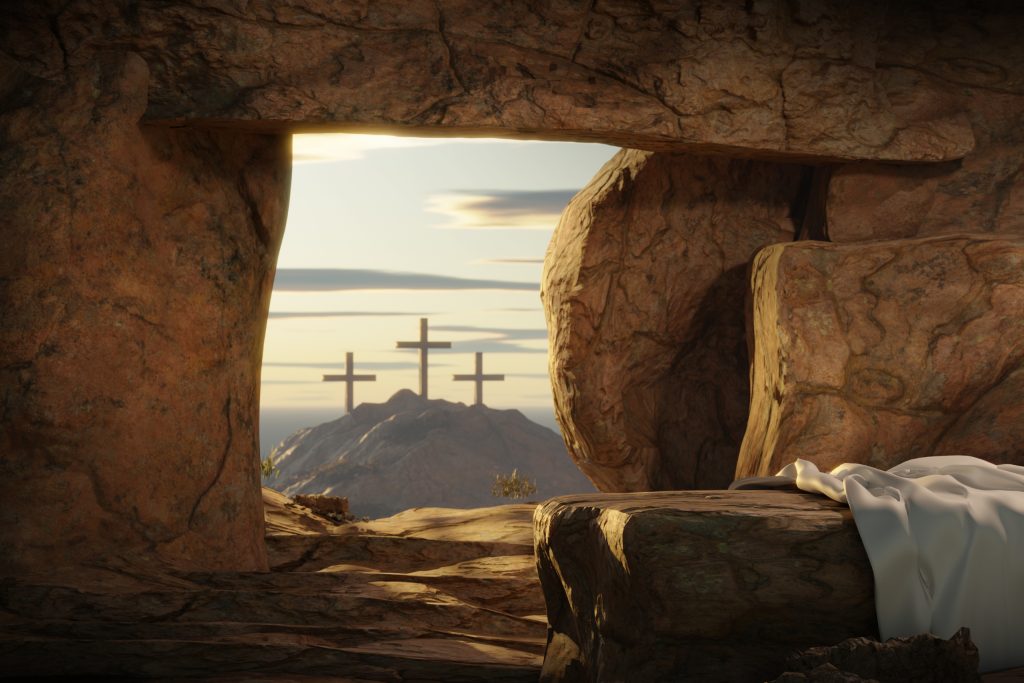 Resurrection happy Easter He is Risen Light in the empty tomb with crucifixion at sunrise