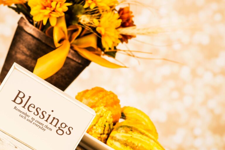 A table featuring a sign that reads "Blessings," along with a collection of Bible verses focused on blessings.